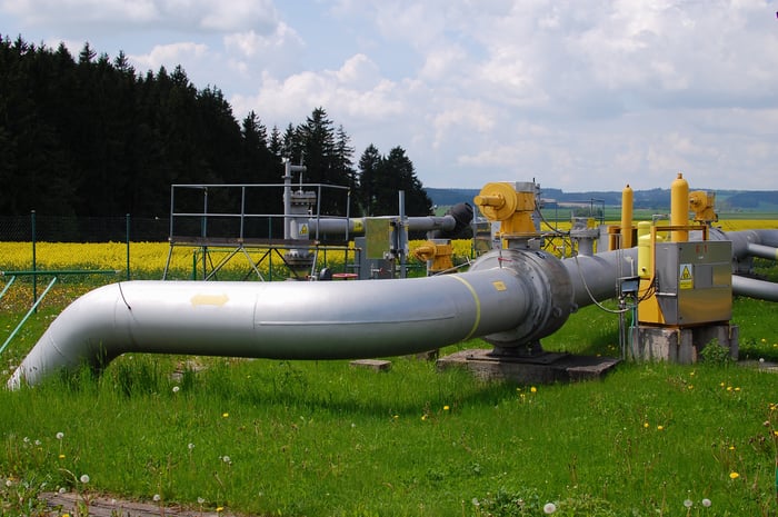 Part of natural gas pipeline control station in the middle of a field.