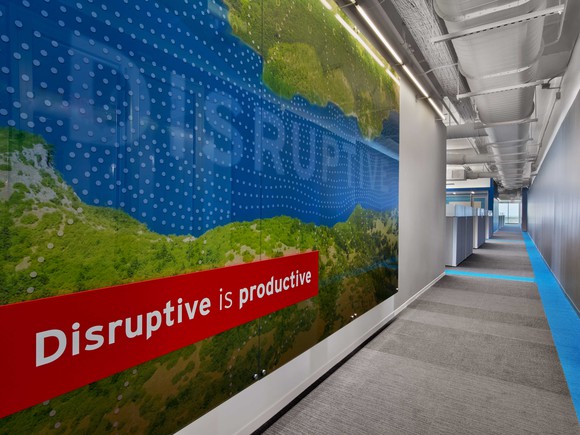 "Disruptive is productive" slogan on a wall at Red Hat's headquarters.