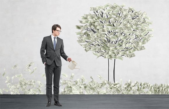 A man "growing" a money tree.