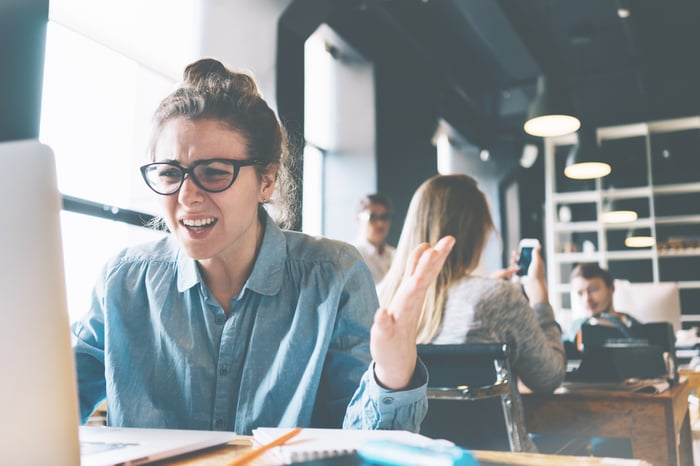 Stressed-out woman on laptop