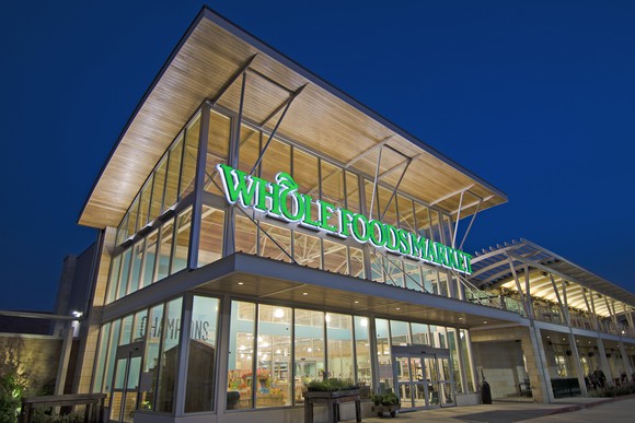 Whole Foods store entrance at night.