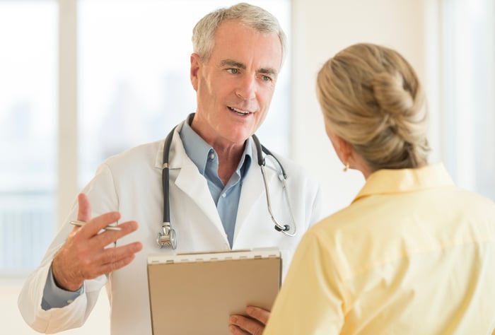 A doctor having a discussion with a patient.