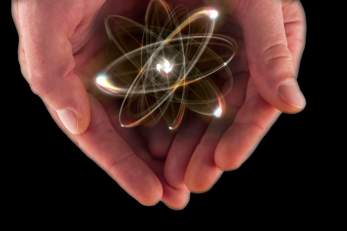 An atom in a pair of hand.