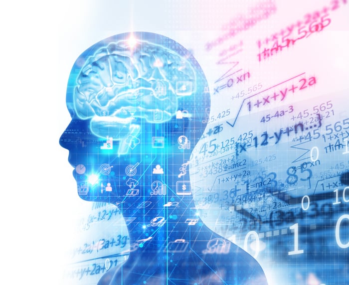 Drawing of a profile of a human head emphasizing brain overlaid with mathematical formulas