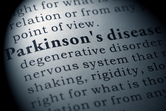 Paper with definition of Parkinson's disease written on it.