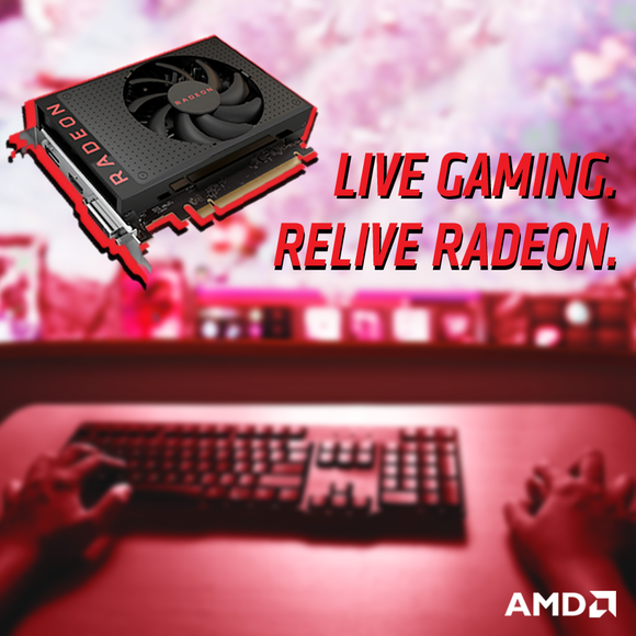 A Radeon GPU with a person using a computer in the background.