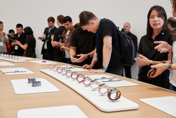 A line up of Apple Watches.