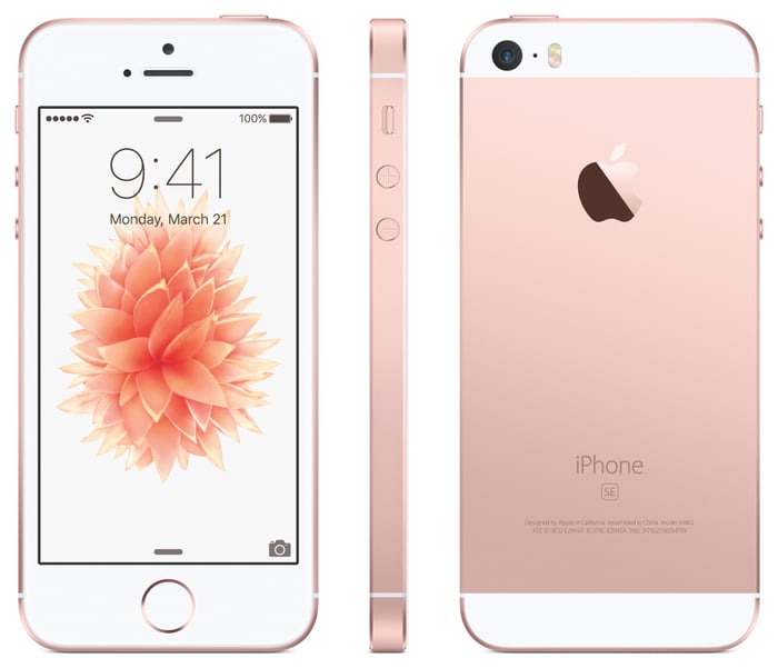 The front, side, and back of the iPhone SE in rose gold. 