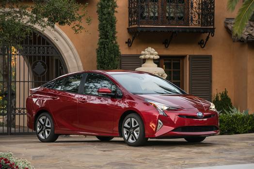 A red 2017 Toyota Prius hybrid sedan. 