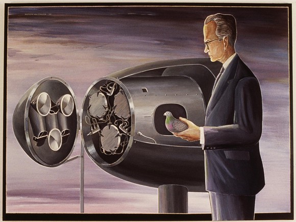 B.F. Skinner holding a pigeon next to a bomb with three miniature cockpits