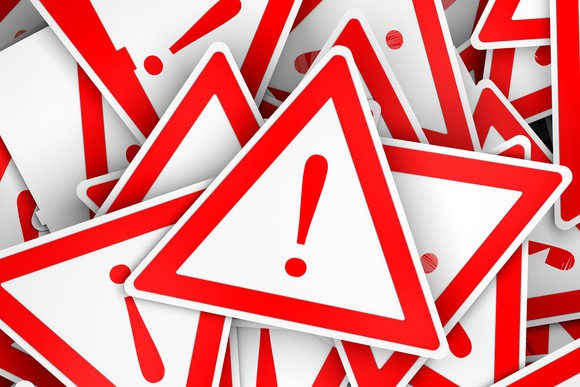 A pile of danger signs: white triangles outlined in red with an exclamation mark in the middle.
