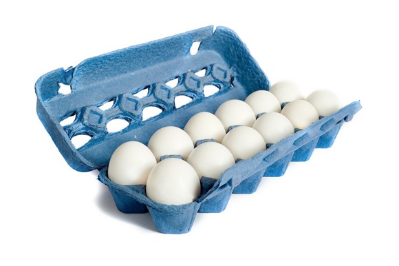 Dozen white eggs in a blue carton.