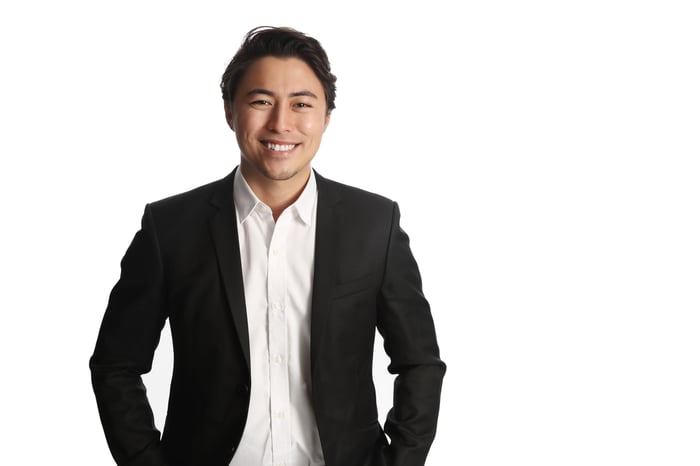 Smiling professional man against a white background