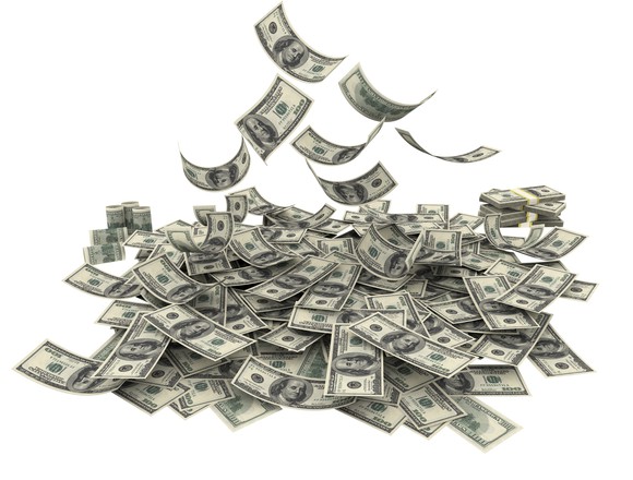 Money falling from above, forming a pile