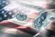 A $100 billion faded into an American flag.