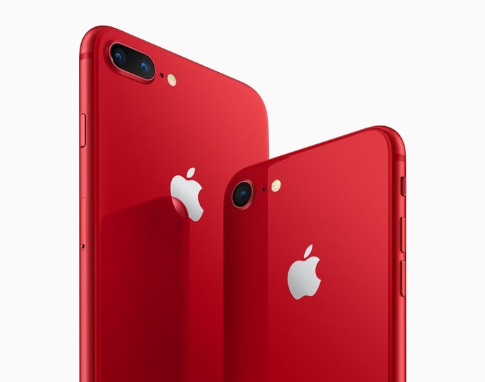 An Apple iPhone 8 Plus (left) and iPhone 8 (right) in red.