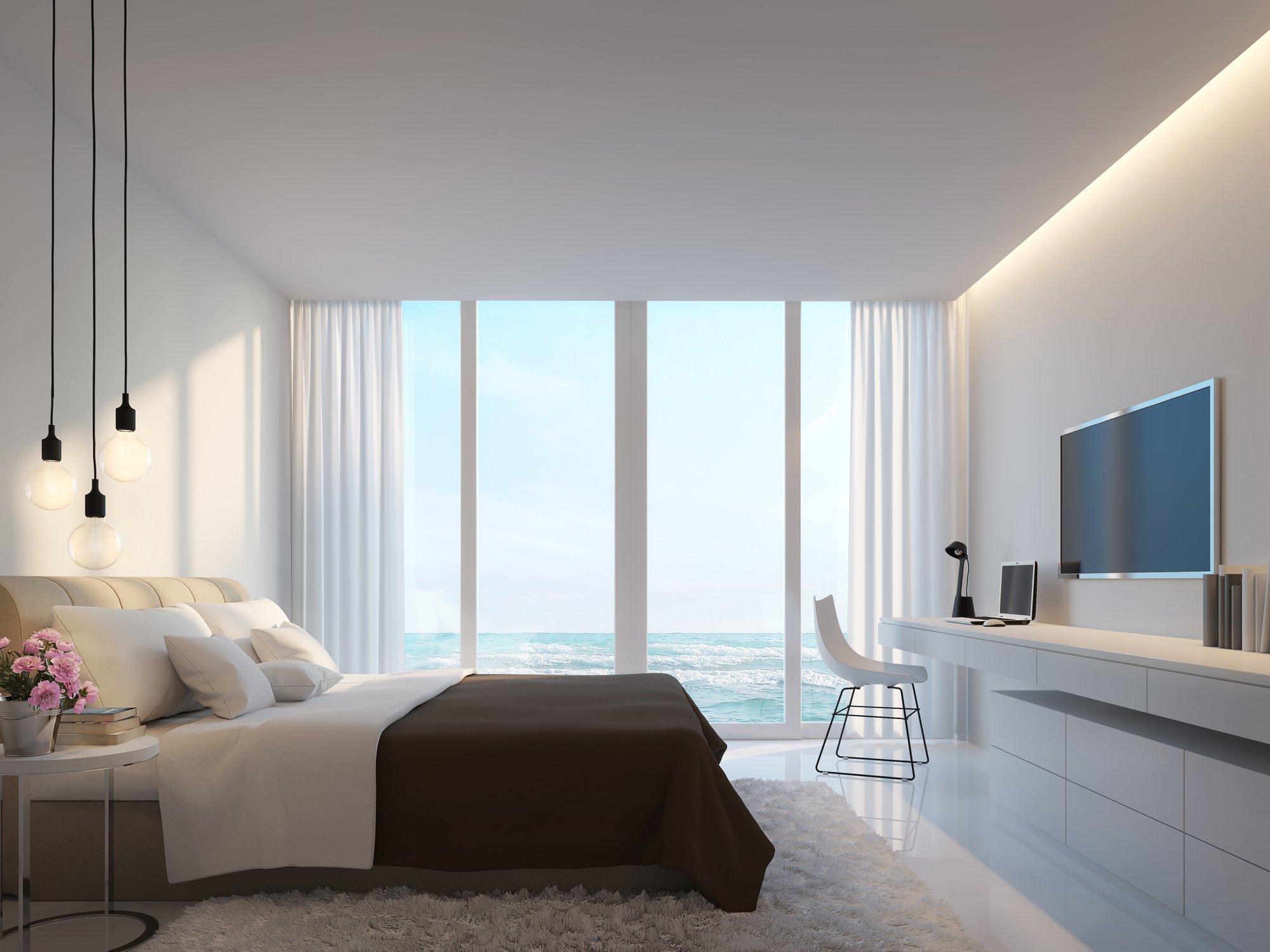 A modern high-end hotel room with a view over the water.