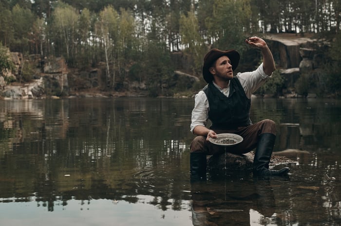 A miner panning for gold