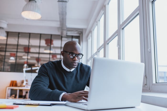 Young male professional at a laptop