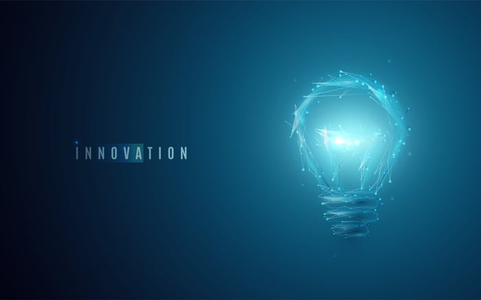 A light bulb with the word innovation glowing to the left