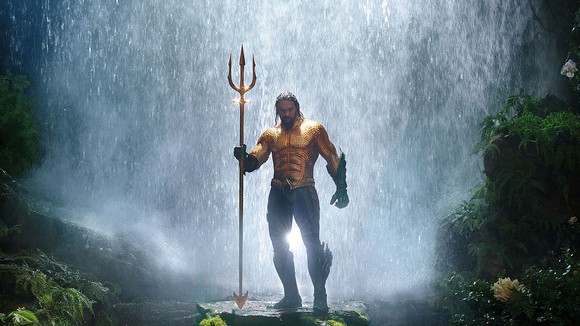 Aquaman in front of waterfall