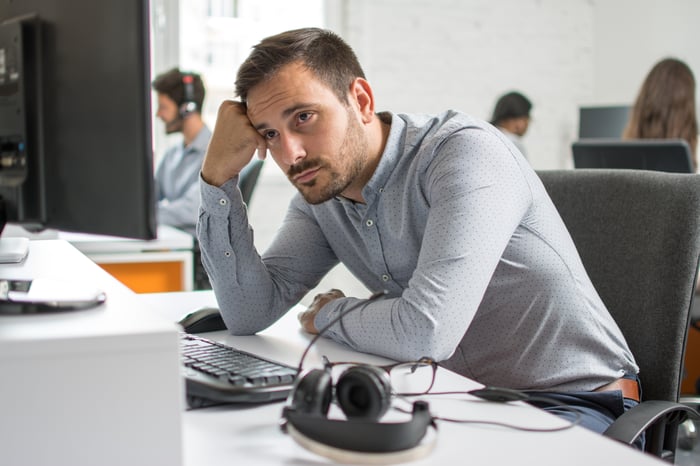 Man at desk with worried expression