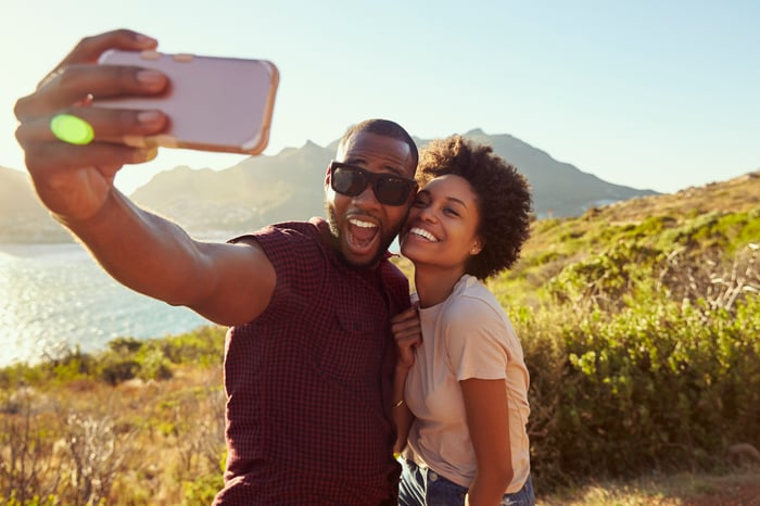 Couple taking selfie outdoors