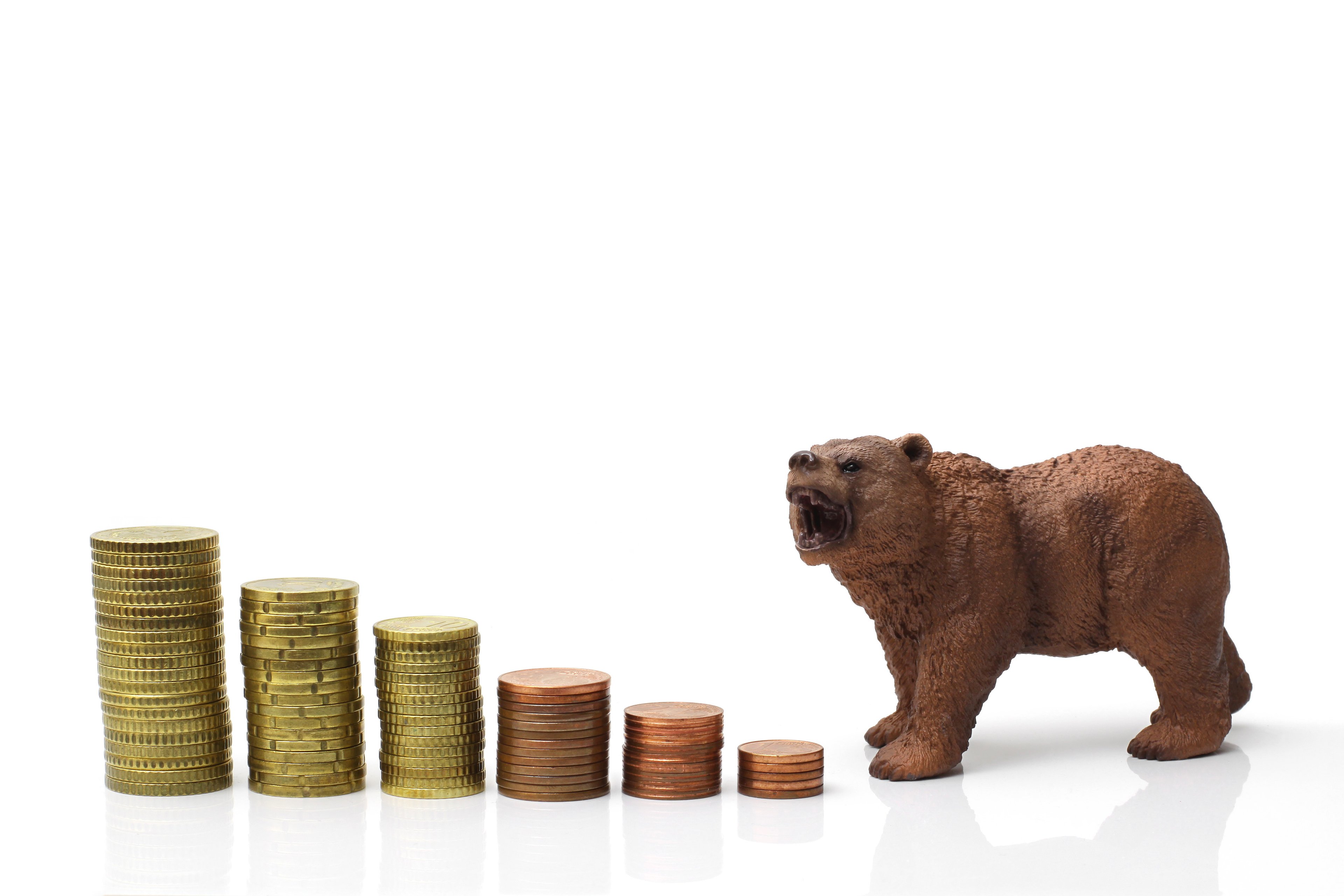 Bear and coins heading downward