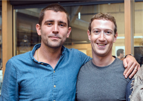 Chris Cox standing with his arm around Mark Zuckerberg