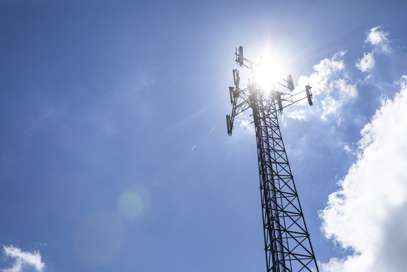 A wireless tower against a blue sky