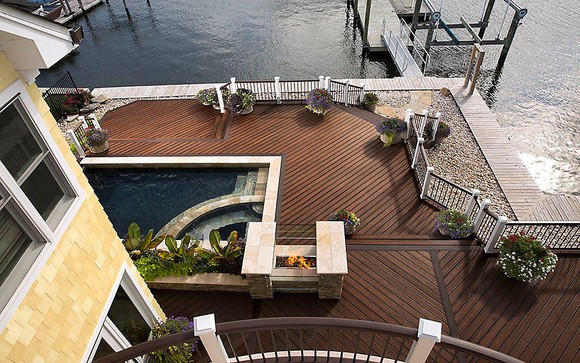 Trex composite decking displayed as part of a large deck with swimming pool and dock