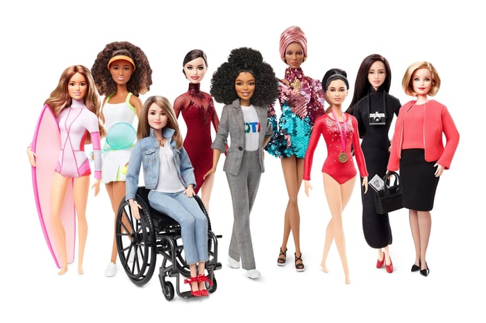 A lineup of Barbie dolls.