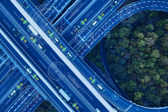 An overhead view of autonomous vehicles on a highway.