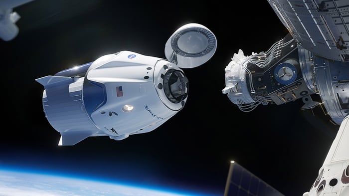 Artist's rendering of SpaceX Crew Dragon docking with International Space Station