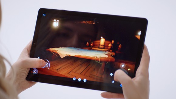 A person playing a video game on a tablet