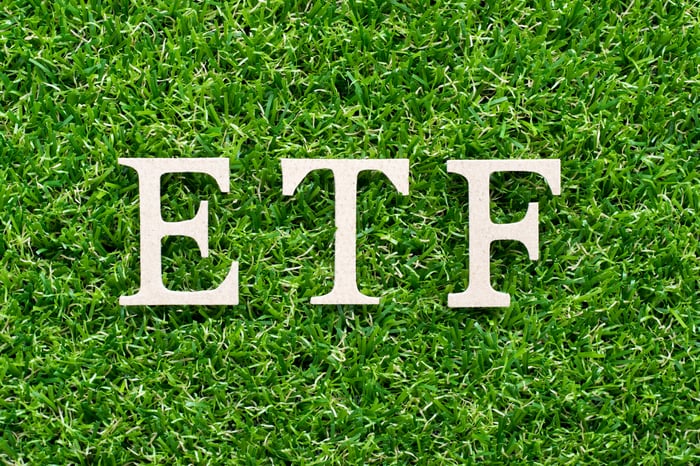 The acronym ETF on a bed of grass