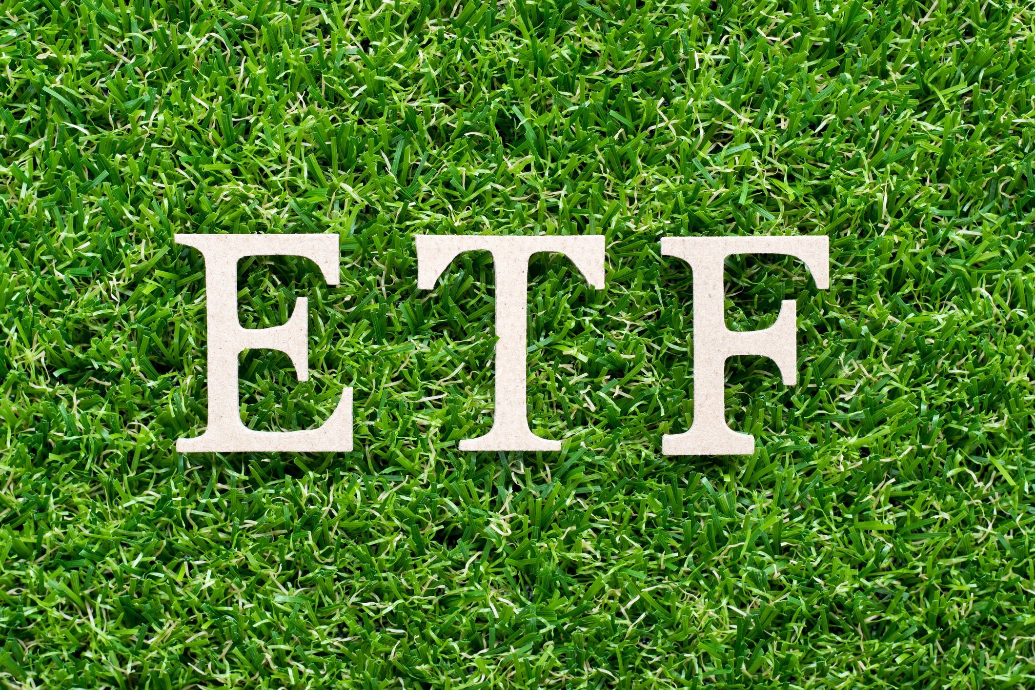 19_03_08 the letters ETF on a bed of green grass_GettyImages-1127790738