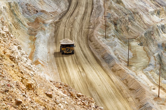 A large truck carrying ore from a mine.
