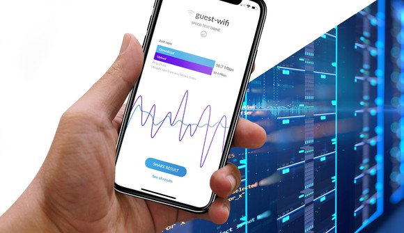 closeup of hand holding a phone opened to Ubiquiti's wifi speed test app.