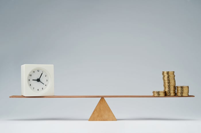 Seesaw with clock and coins
