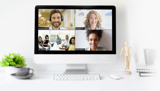 A computer screen divided into quarters, with each quarter showing a person or group of people.