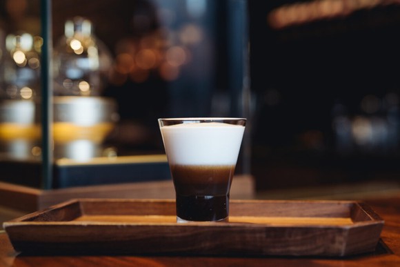 Starbucks' new Chocolate Bicerin Reserve beverage on a wood tray