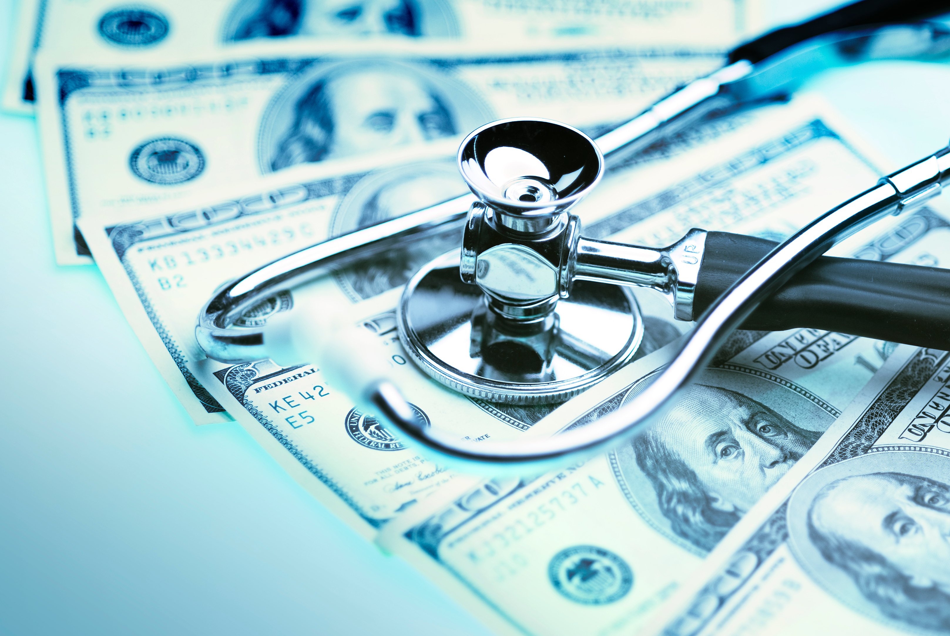 financial health stethoscope money cash hundred bills medical healthcare