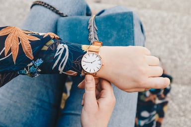 Close-Up of Female in Floral Shirt Checking Watch