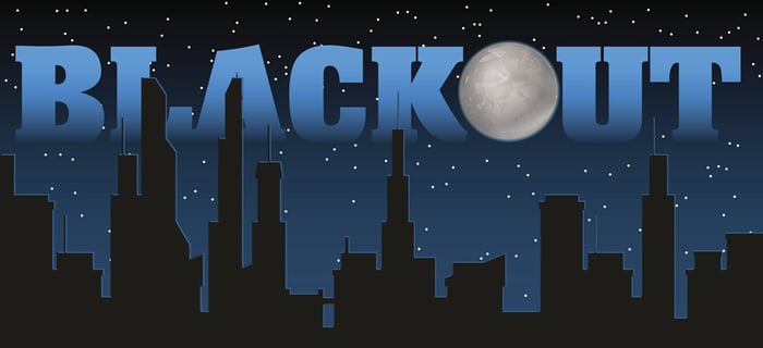 Dark cityscape with Blackout written above in blue.