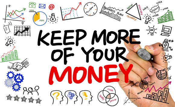 A hand is writing keep more of your money on a clear plane, surrounded by doodles of graphs, lightbulbs, brains, and so on.