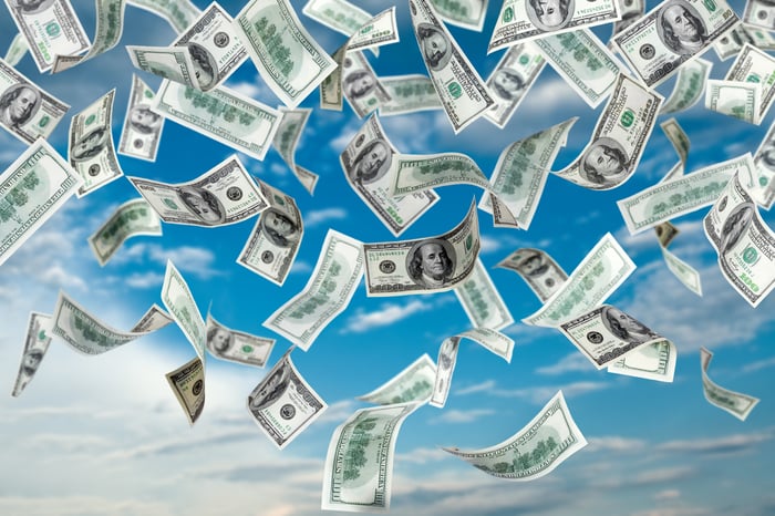 Money rains from the sky.
