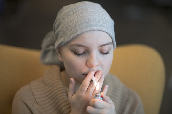 Female cancer patients smoking some medical marijuana.