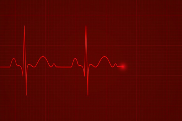 Glowing red heartbeat monitor graph flatlines
