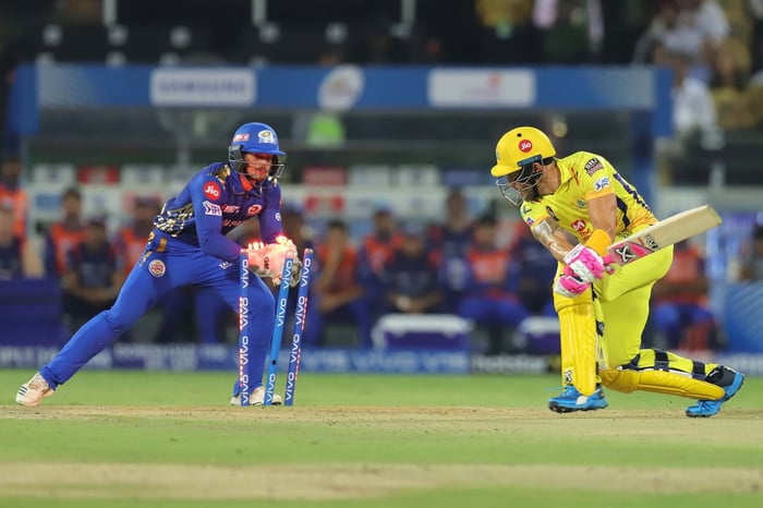 Two cricket players on the field during a game